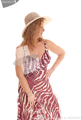 Image of Happy blond woman with straw hat.