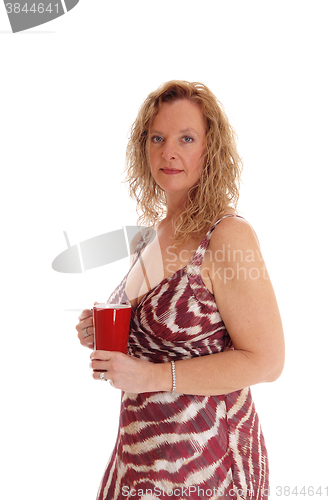 Image of Blond woman with red coffee mug.