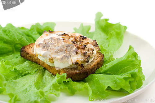 Image of green salad with goat cheese and toast