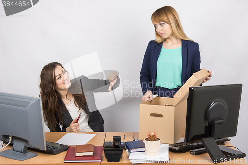 Image of Office gesture girl humiliates the dismissed colleague