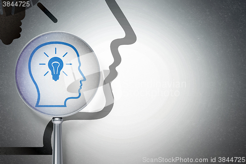 Image of Data concept:  Head With Lightbulb with optical glass on digital background