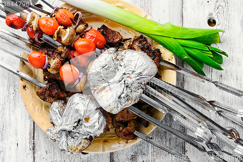 Image of Meat roasted on skewers