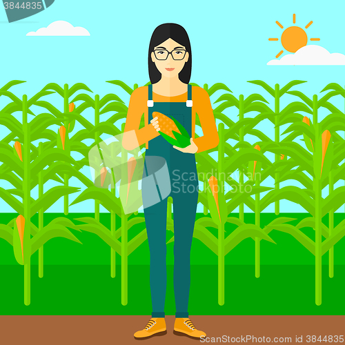 Image of Farmer holding corn.