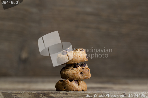 Image of Brown cookies on wooden background