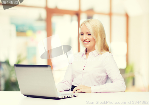 Image of smiling businesswoman or student with laptop