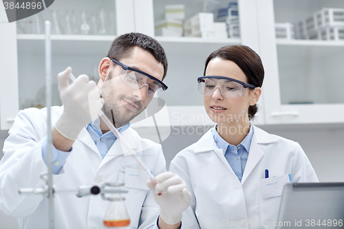 Image of young scientists making test or research in lab