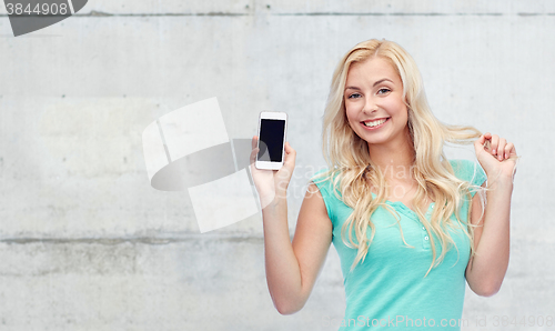 Image of happy young woman or teenage girl with smartphone