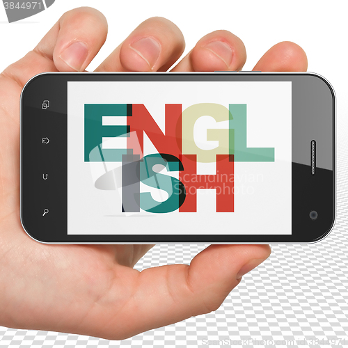 Image of Studying concept: Hand Holding Smartphone with English on  display