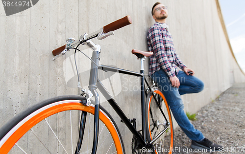 Image of close up of hipster fixed gear bike and man