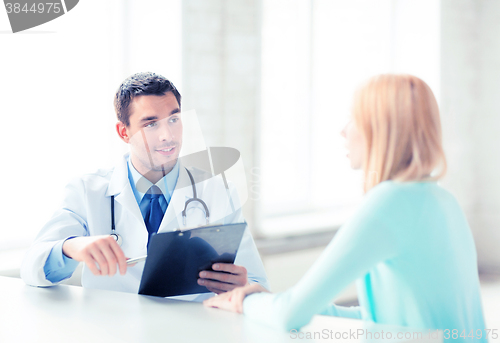 Image of male doctor with patient