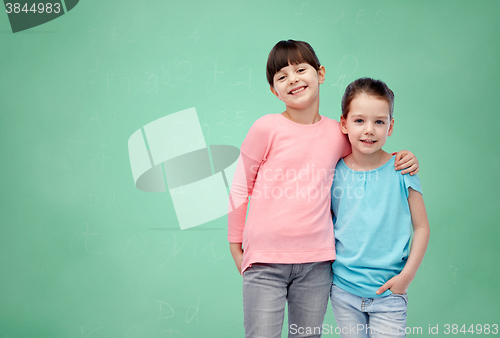 Image of happy smiling little girls hugging