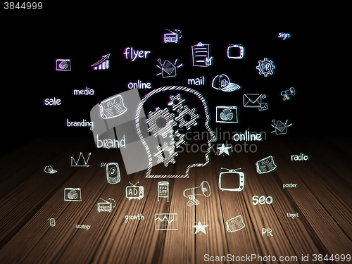 Image of Marketing concept: Head With Gears in grunge dark room