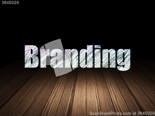 Image of Marketing concept: Branding in grunge dark room