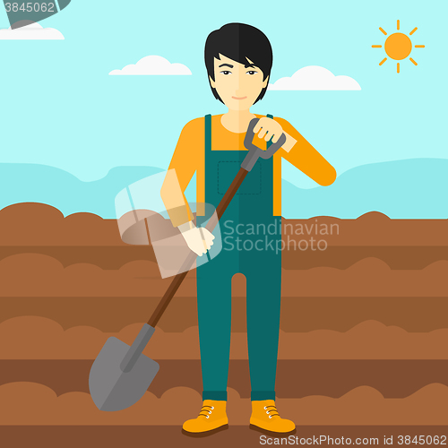 Image of Farmer on the field with shovel.