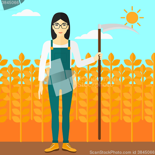 Image of Farmer on the field with scythe.