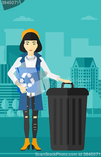 Image of Woman with recycle bins.