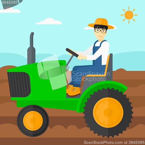 Image of Farmer driving tractor.