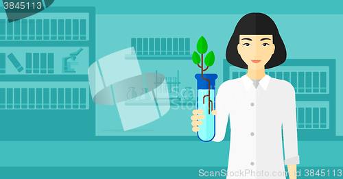 Image of Laboratory assistant with test tube.