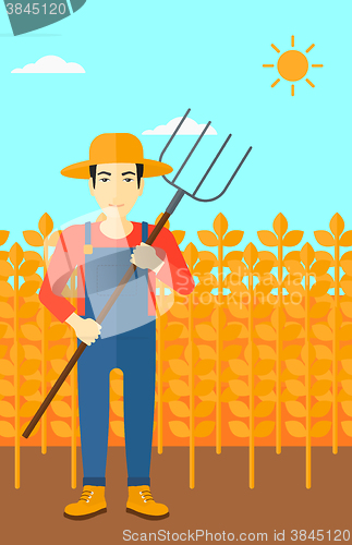 Image of Farmer with pitchfork.