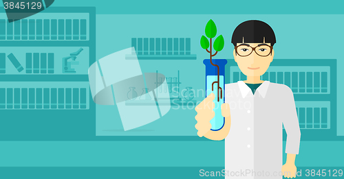 Image of Laboratory assistant with test tube.