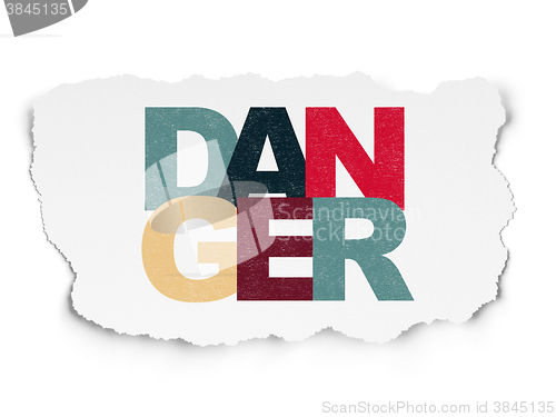 Image of Security concept: Danger on Torn Paper background