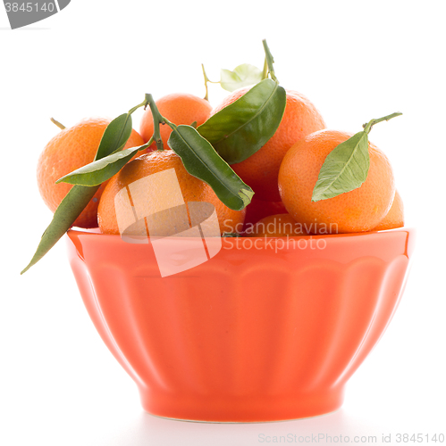 Image of Tangerines on ceramic orange bowl 