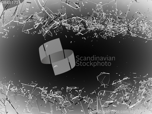 Image of Pieces of splitted or cracked glass on grey