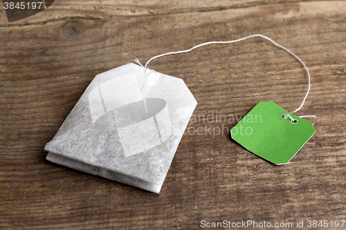 Image of Teabag on wooden background   