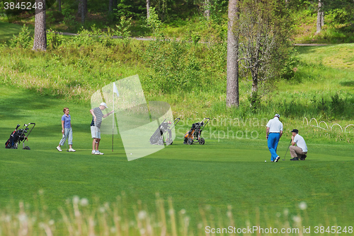 Image of Playing golf.