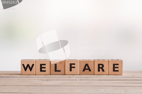 Image of Welfare sign made of wooden cubes