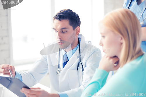 Image of male doctor with patient