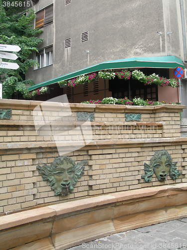 Image of public water fountain for drinking or bathing  historic tourist 