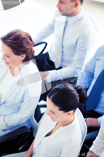 Image of businessmen and businesswomen on conference