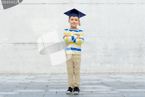 Image of happy boy in bachelor hat or mortarboard