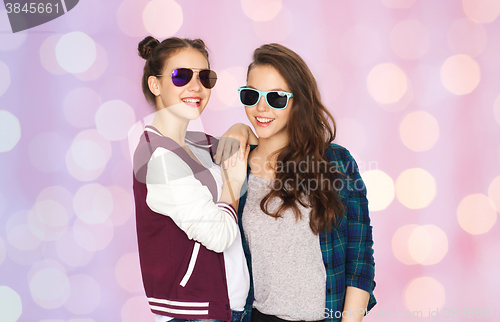 Image of happy smiling pretty teenage girls in sunglasses