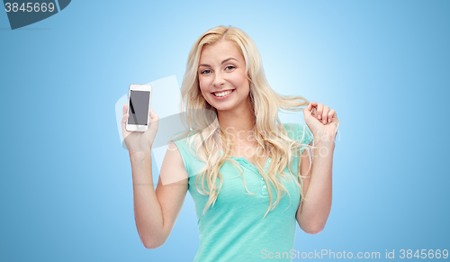 Image of happy young woman or teenage girl with smartphone