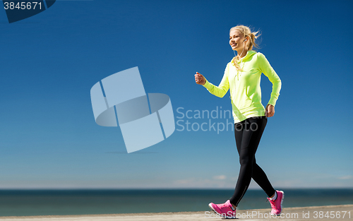 Image of woman doing sports outdoors