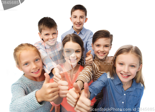 Image of happy children showing thumbs up