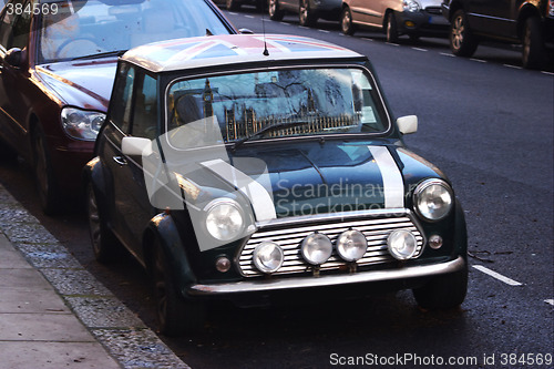 Image of Cars, UK flag, reflection of Big Ben, Houses Parliament