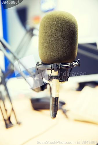 Image of microphone at recording studio or radio station