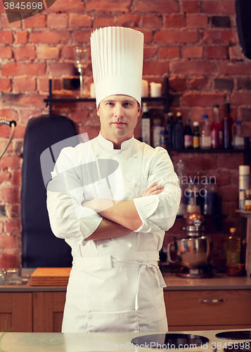 Image of happy male chef cook in restaurant kitchen