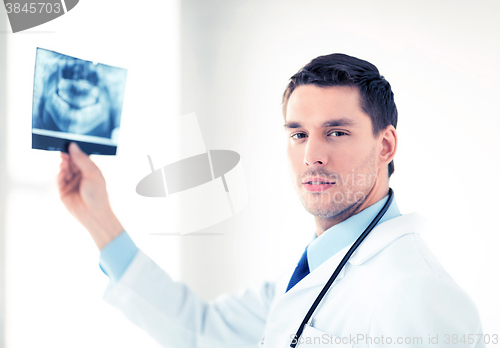 Image of male doctor or dentist with x-ray