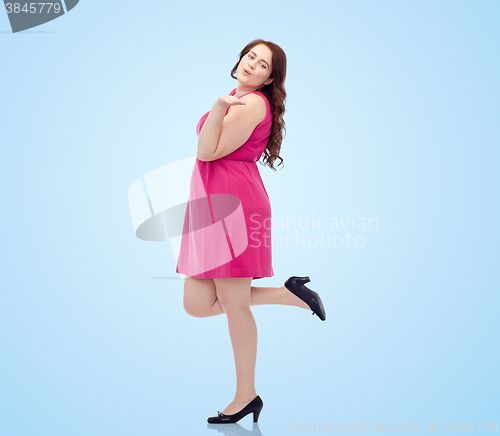 Image of happy young plus size woman and sending blow kiss