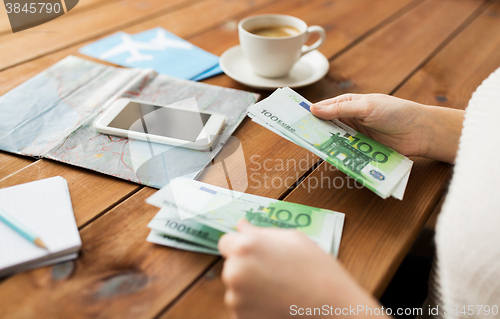 Image of close up of traveler hands counting euro money