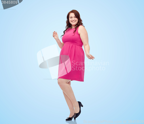 Image of happy young plus size woman dancing in pink dress