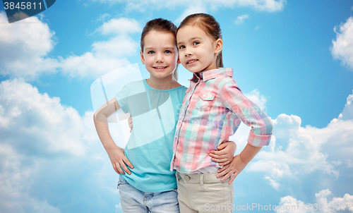 Image of happy smiling little girls hugging