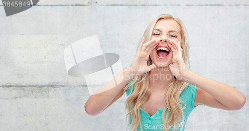 Image of young woman or teenage girl shouting