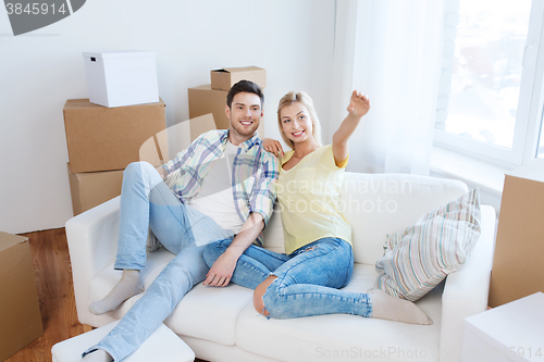 Image of couple with boxes moving to new home and dreaming