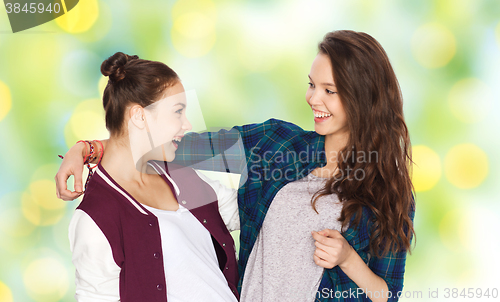 Image of happy smiling pretty teenage girls hugging