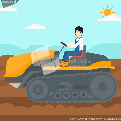 Image of Farmer driving tractor.